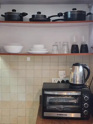 a stove with a pot on top of it in a kitchen at Marina Nest - Spacious one bed apt with a view in Marina, walking distance from JBR, metro & tram! in Dubai