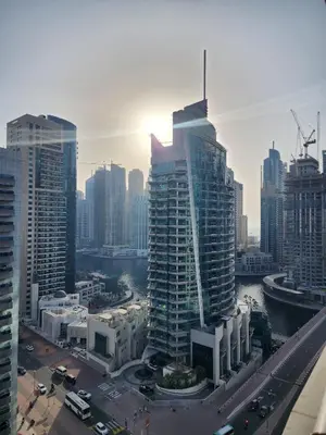 a view of a city with tall buildings at Marina Nest - Spacious one bed apt with a view in Marina, walking distance from JBR, metro & tram! in Dubai