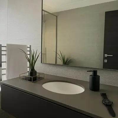a bathroom with a sink and a mirror at Massive LuxXo Family & Friends Villa with Terraces, Private Parking, Pool & Quick Access to Dubai Mall in Dubai