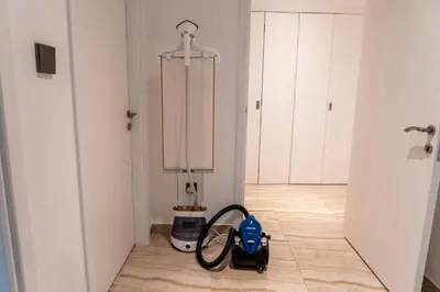 a vacuum cleaner sitting on a floor in a room at Female - Girls Joyful Journeys - girls only bedspace in Dubai