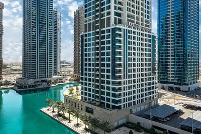 an aerial view of a city with tall buildings at Chill Studio with Balcony and Pool View in Dubai