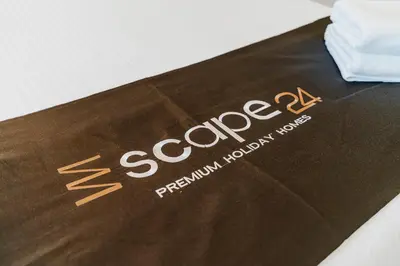 a brown box with the word scorate written on it at Escape24 Elegant 2BR with Garden View in Dubai Hills in Dubai