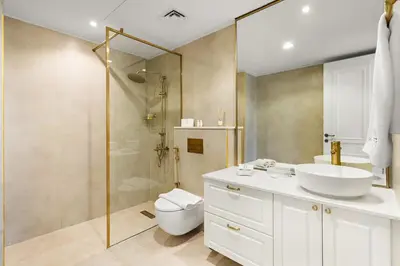 a bathroom with a toilet and a sink and a shower at FIRST CLASS 1BR Spacious Comfort Awaits in Dubai