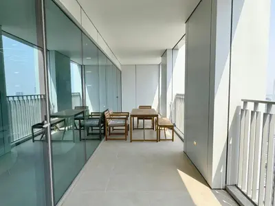 a balcony with a table and chairs on a building at DVR 4 BR Apartment available in Downtown View 2 in Dubai