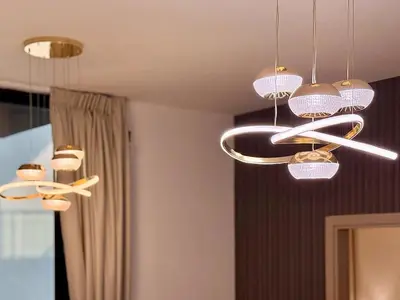 a room with several lights hanging from a ceiling at Brand New-Fully Furnished Elegant 1BR In JVC in Dubai