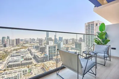a balcony with a view of a city at Frank Porter - Binghatti Corner in Dubai