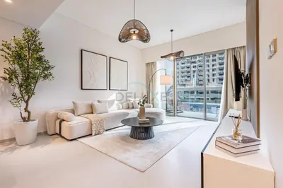 a living room with a couch and a table at City Vibe 1BR with Outdoor Space, Walking Distance to Burj Khalifa and Dubai Mall, Grande, Downtown Dubai by Deluxe Holiday Homes in Dubai