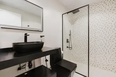 a bathroom with a sink and a glass shower at RH- Heart of Dubai Marina, Sunny & bright 2 BR apartment with big balcony in Dubai