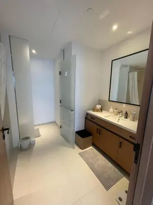 a bathroom with a sink and a mirror at Vida Dubai Marina Apartment at Prime Location in Dubai