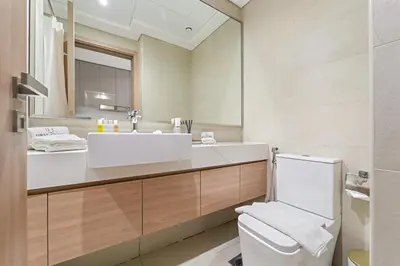 a bathroom with a sink and a toilet at FIRST CLASS Studio Urban Elegance in Dubai