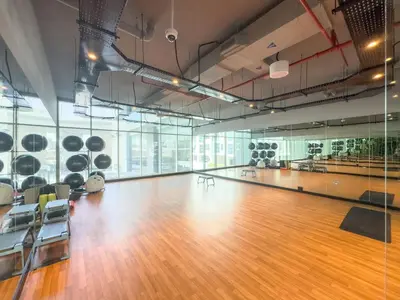 an empty gym with a wooden floor and a bowling alley at FIRST CLASS 1BR Elegant Marina Hideaway in Dubai
