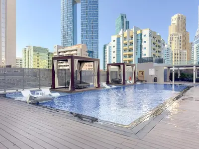 a swimming pool on the roof of a building at FIRST CLASS 1BR Elegant Marina Hideaway in Dubai