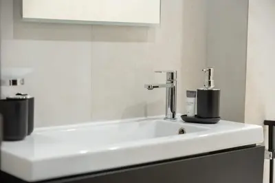 a bathroom with a sink and a mirror at AirDXB - Luxurious 2-Bedroom Apartment in Downtown - Sleeps 4 with Iconic Burj Khalifa Views in Dubai