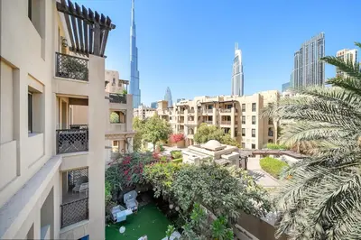 an aerial view of a city with buildings at Charming Old Town Dubai 2BR Retreat with Burj Khalifa Balcony View in Dubai