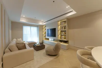 a living room with a couch and a tv at Daniels 2BR at Princess Tower with Sea View in Dubai