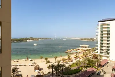 a view of the beach and the ocean from a building at Daniels 1BR at Shoreline with Sea View in Dubai