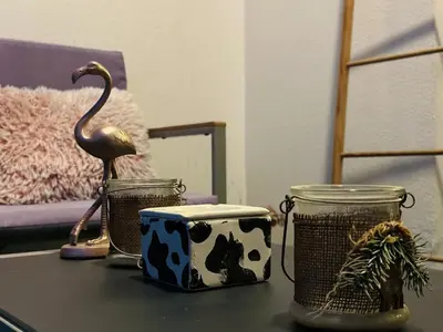 a table with a flamingo and two jars on it at Peaceful 2 Bed Oasis Suite in JVC in Dubai