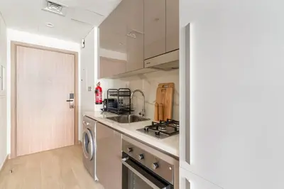 a kitchen with a sink and a stove at Stunning Luxury Studio in Dubai in Dubai