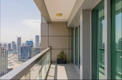 a balcony with a view of a city at AWS Holiday Homes - Style in Downtown in Dubai