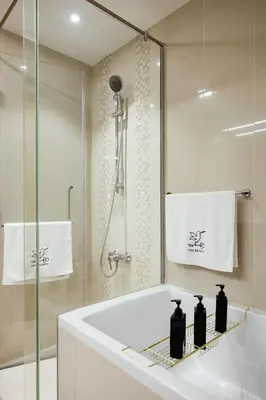 a bathroom with a bath tub and a shower at FULL Burj Khalifa View Luxury Stay in Downtown in Dubai