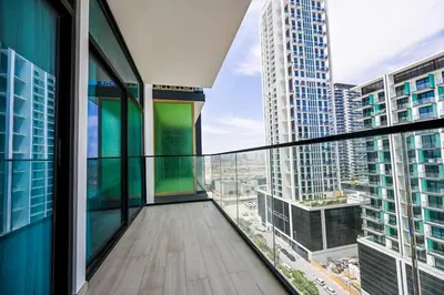 a balcony with a view of a city at Stunning 1 Bdr luxury residence at JVC in Dubai