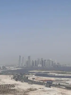 an aerial view of a city with tall buildings at Cozy 1BR, 2Min to Dubai Mall in Dubai