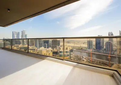 a balcony with a view of a city skyline at Stylish 2BR Downtown Apartment Burj & Mall Nearby in Dubai