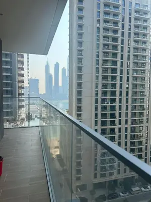 a balcony in a building with a view of a city at Palm & Marina View 1BR Apartment at Emaar Beachfront in Dubai
