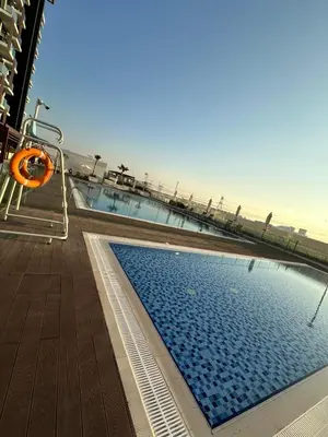 a swimming pool on the deck of a cruise ship at Luxury studio near Burj Khalifa in Dubai