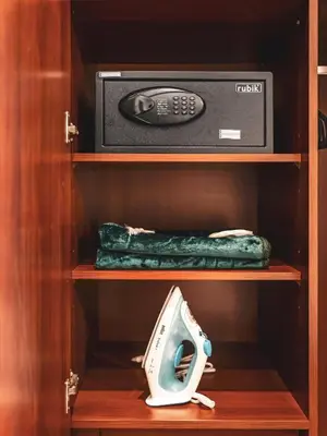 a cabinet with a microwave and a radio in it at New Fairmont Residence with private beach on PalmJumeirah in Dubai