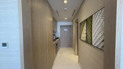 a hallway leading to a kitchen in a house at Ultra-Luxury Studio Palm Tower St. Regis Views High Floor DRP Holiday Homes in Dubai