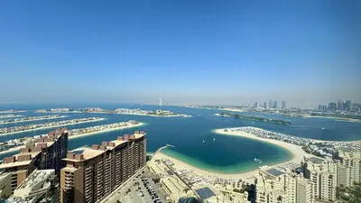 an aerial view of a harbor in a city at St. Regis Sky Residence at Palm Tower by DRP Holiday Homes in Dubai