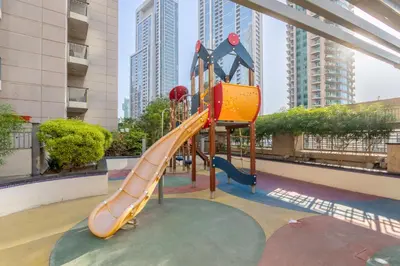 a playground in a building with a slide at Vacationer I Luxe Studio I Steps to Burj Khalifa & Dubai Mall I Free Parking, Pool, Gym & Wi-Fi in Dubai