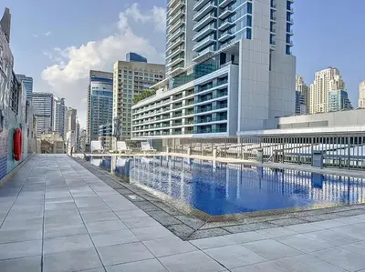 a swimming pool in a city with tall buildings at Azure Residence - Magnificent Three Bed in Marina in Dubai