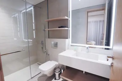 a bathroom with a sink and a toilet and a shower at Luxurious 2BR in Oakley Square Residence, JVC in Dubai