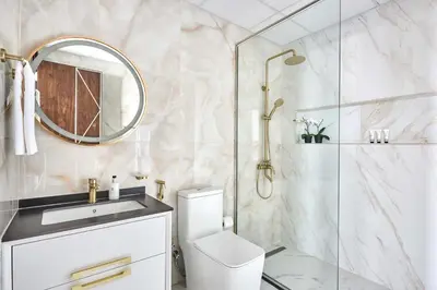 a bathroom with a shower and a toilet and a sink at Frank Porter - Gemz by Danube in Dubai