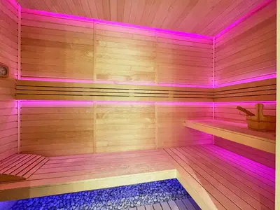 a sauna with purple lights on the inside of it at Frank Porter - Gemz by Danube in Dubai