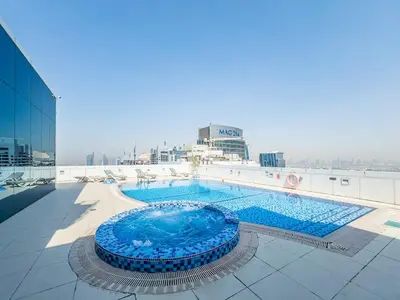 a large swimming pool on top of a building at Stylish Studio Escape in the Heart of JLT in Dubai