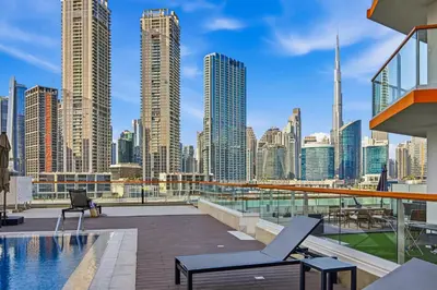 a balcony with a view of a city skyline at Stylish Escape with Balcony, Canal and Burj Khalifa Views Near Dubai Mall in Dubai
