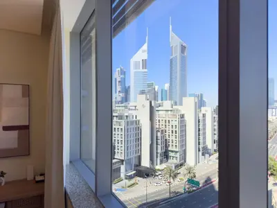 a window with a view of a city at Sleek DIFC Studio Perfect for Business & Leisure in Dubai