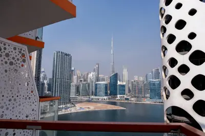 a view of a city skyline from a ship at Stunning City Views and Outdoor Pool, Steps from Iconic Burj Khalifa in Dubai
