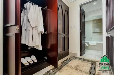 a bathroom with a closet with white shoes on it at Full View Burj Khalifa and Fountains -Souk Al Bahar- Dream View holiday Home Rental in Dubai