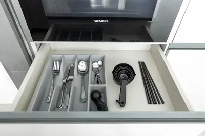 a drawer filled with utensils in a kitchen at New 1BR with Walk-in Wardrobe in Greenish Community in Dubai