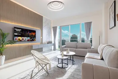a living room with a couch and a table at Great View from 63th Floor! Amazing Pool with Burj View! Grande Signature! in Dubai