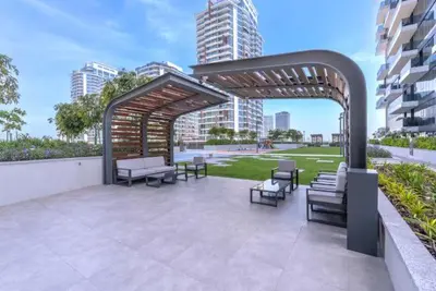 a pavilion with chairs and tables on a patio at Vogue Al Wasl 1 Residences Near Zabeel Park and World Trade Centre, Two Bedroom Apartment with Balcony and Dubai Frame, Access to all Amenities, Walkable to Max Fashion Metro Station in Dubai