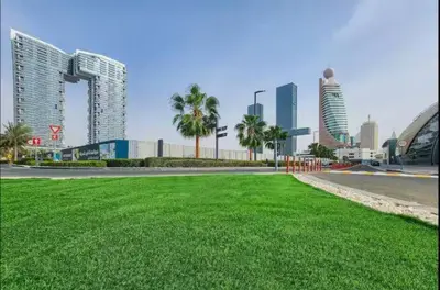 a city with tall buildings and a field of grass at Vogue Al Wasl 1 Residences Near Zabeel Park and World Trade Centre, Two Bedroom Apartment with Balcony and Dubai Frame, Access to all Amenities, Walkable to Max Fashion Metro Station in Dubai