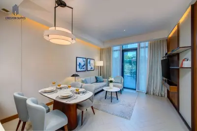 a living room with a table and a couch at Luxury 1-BR at Dubai Opera Stay in Dubai