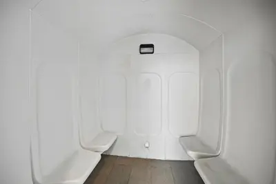 a bathroom with three urinals in a white wall at Serene Escape in Bustling Marina and JBR, Ensuite 2BR, Sky Garden Access in Dubai