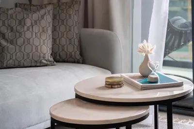 a living room with a coffee table and a couch at KeyRock Living - Zada 1BR with Pool & Gym Access in Dubai