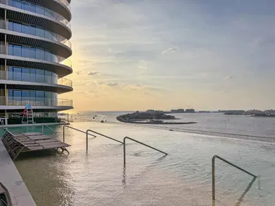 a view of a building and a body of water at Coastal Elegance 1-Bedroom in Grand Bleu in Dubai